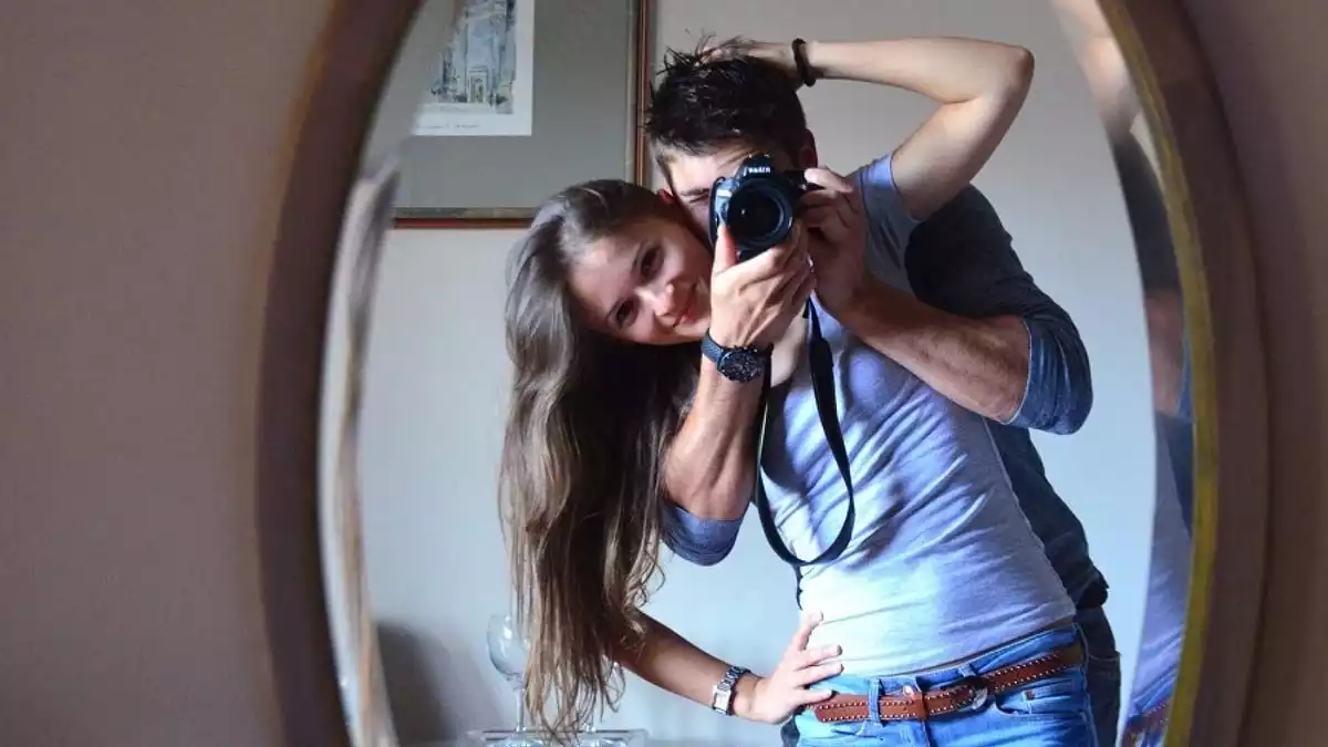 couple in front of a mirror