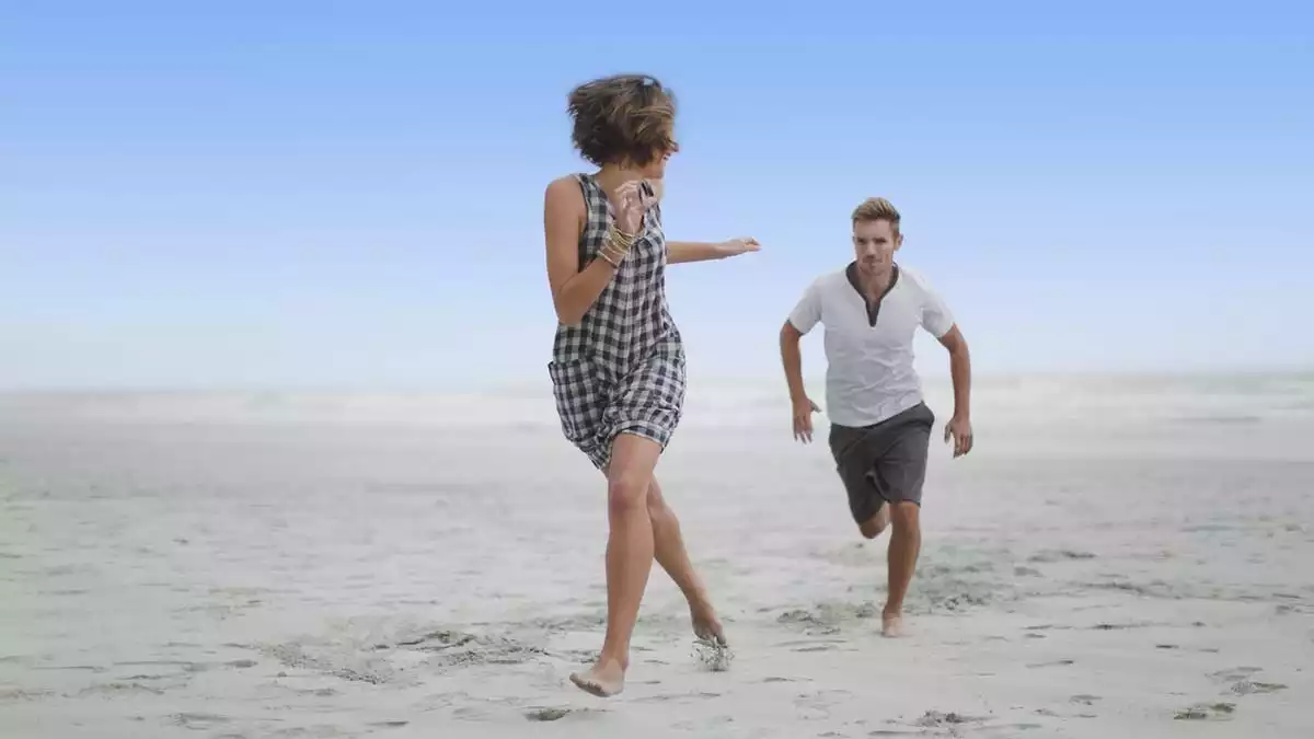 A girl being chased by a boy