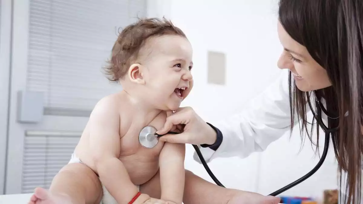 pediatrician with a baby