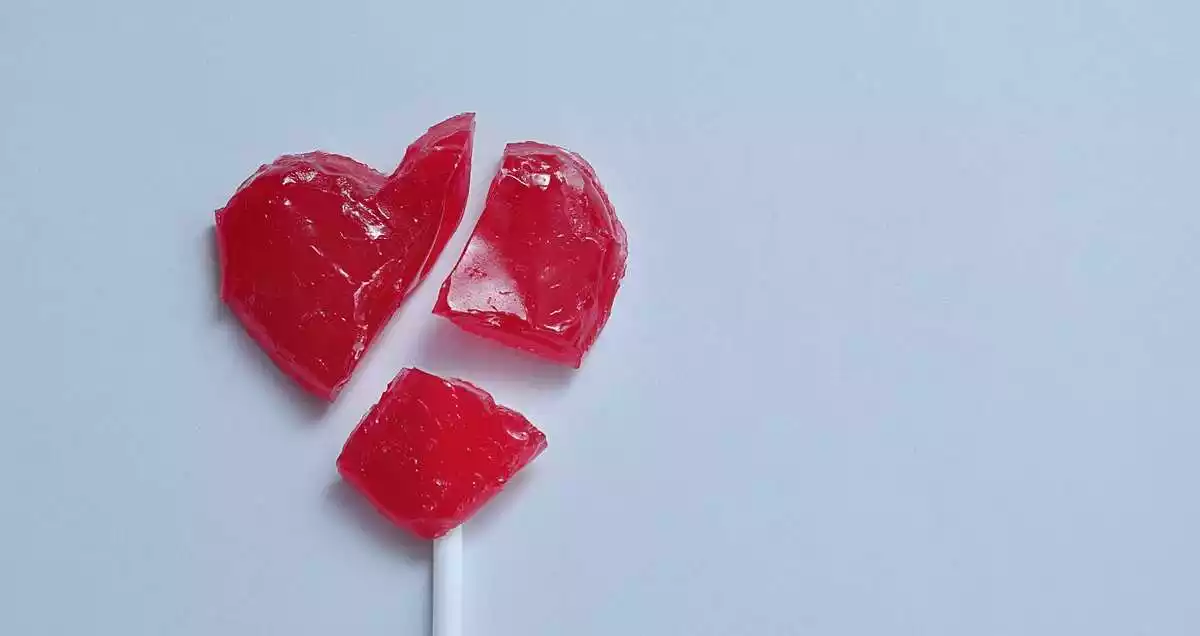 A broken heart-shaped lollipop