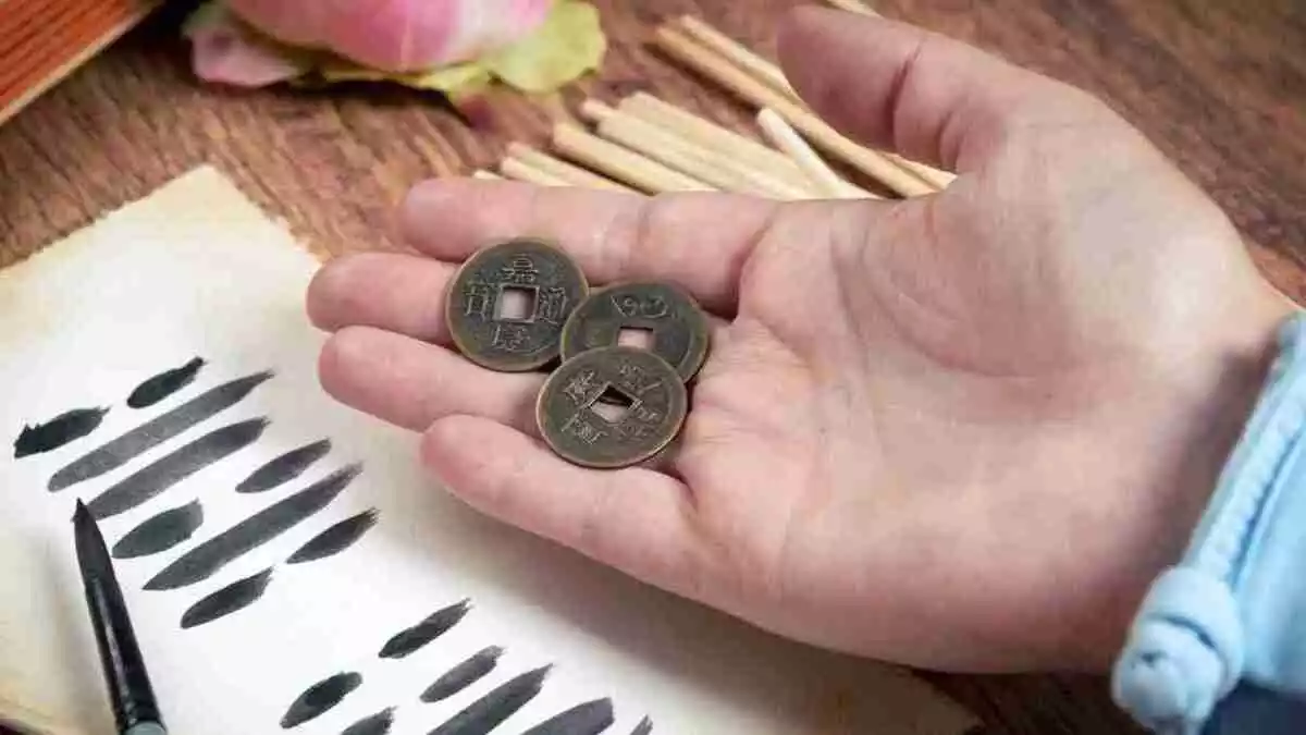 I ching ancient Chinese oracle with Yijing hexagram, old coins and stalks