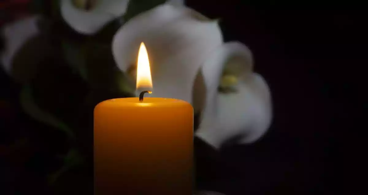 A candle and some flowers