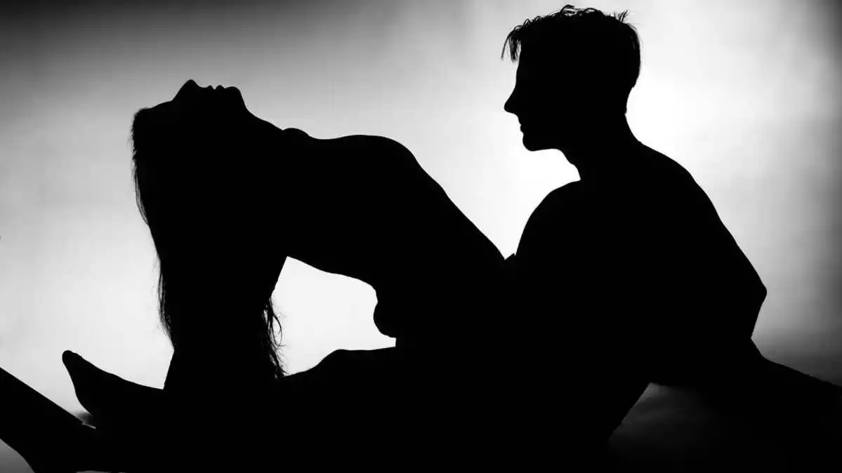 A man and a woman's silhouette in a sexual position