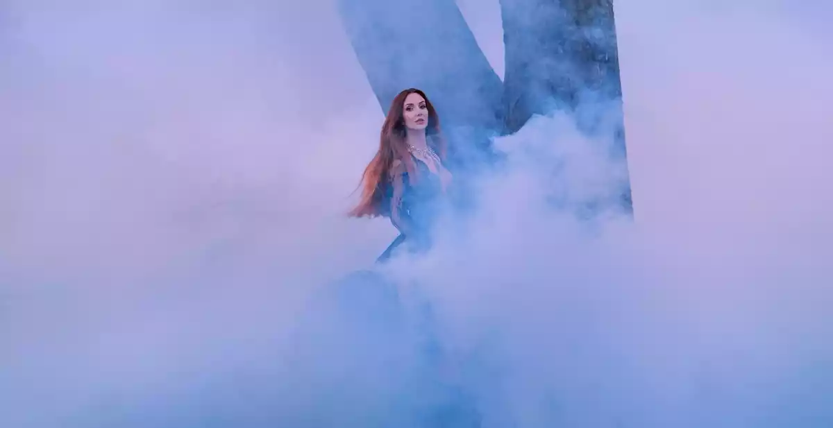 A woman in the middle of a lot of smoke