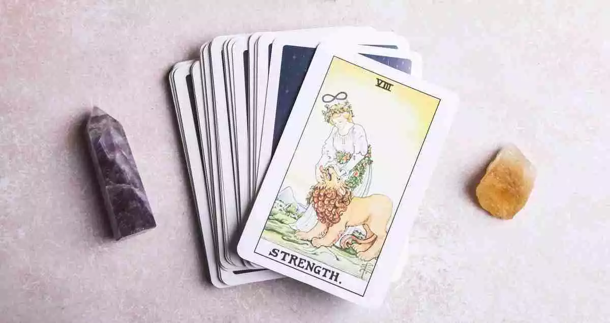 Strength tarot card on a tarot card deck