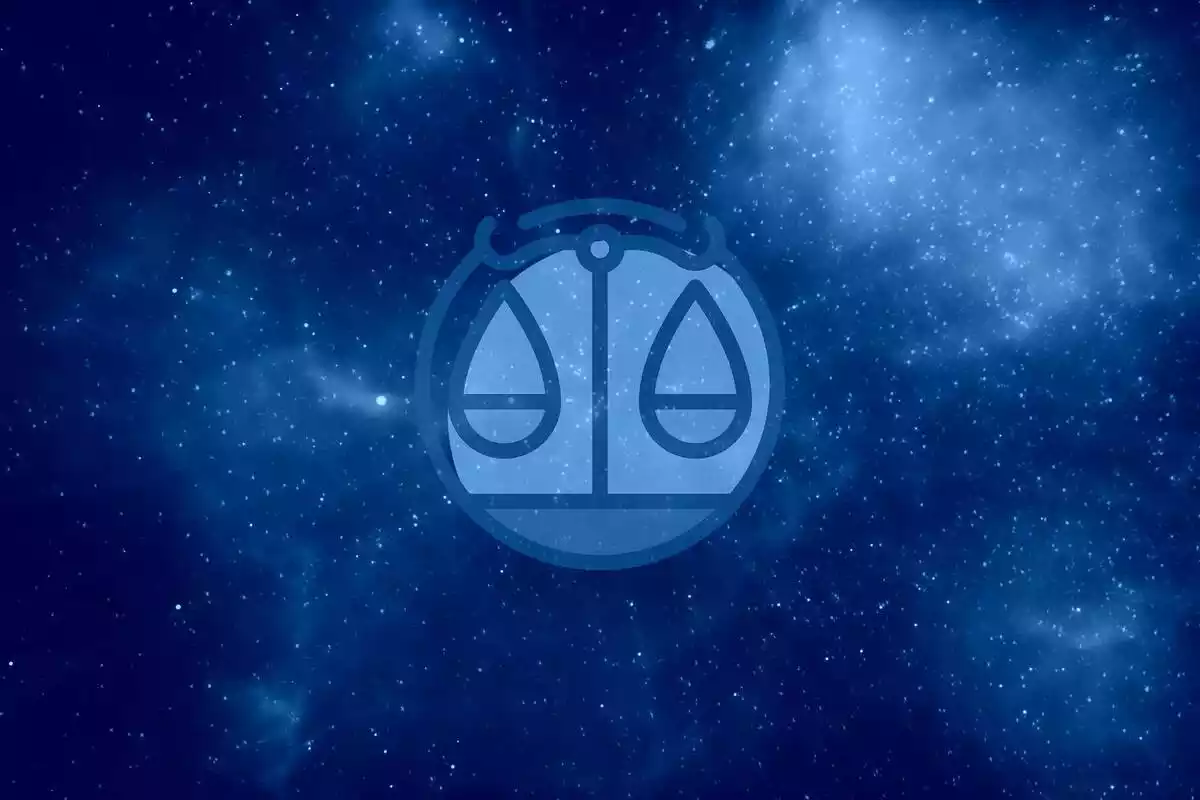 The Libra sign in blue with a starry sky background