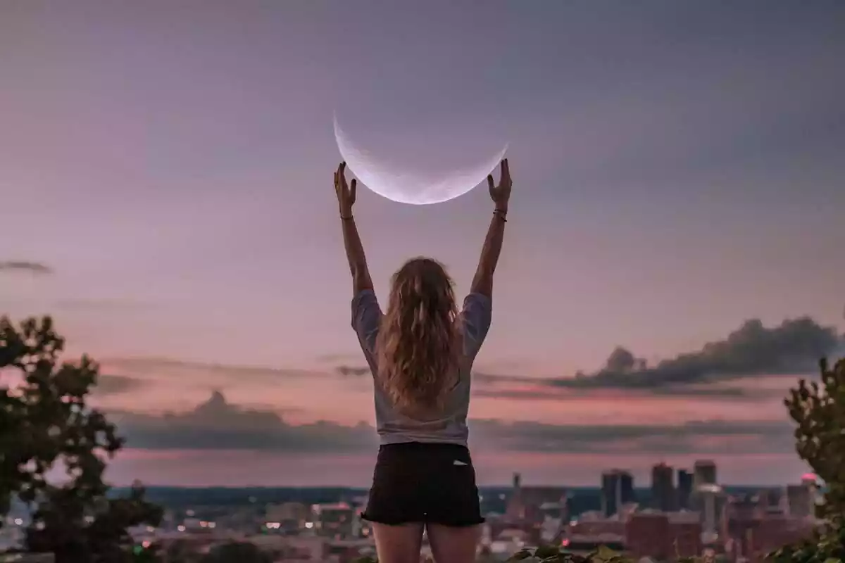 Woman holding the moon
