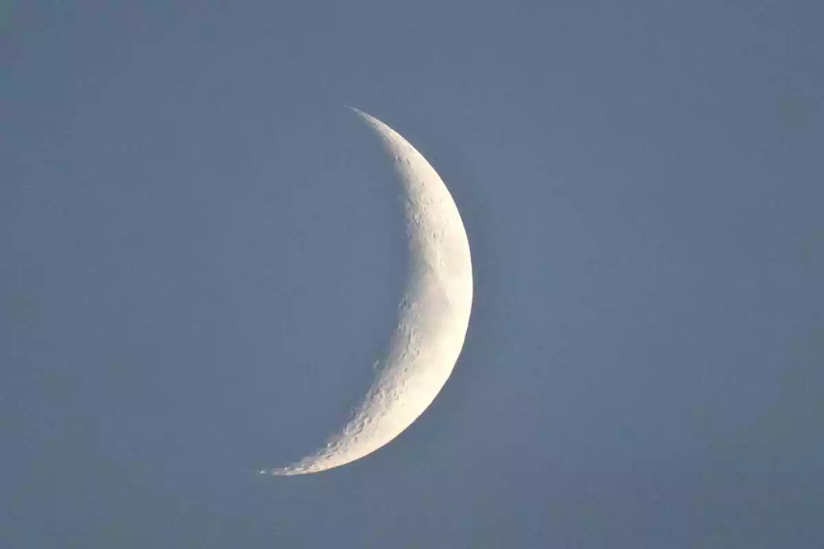 Picture of the new moon in a blue background