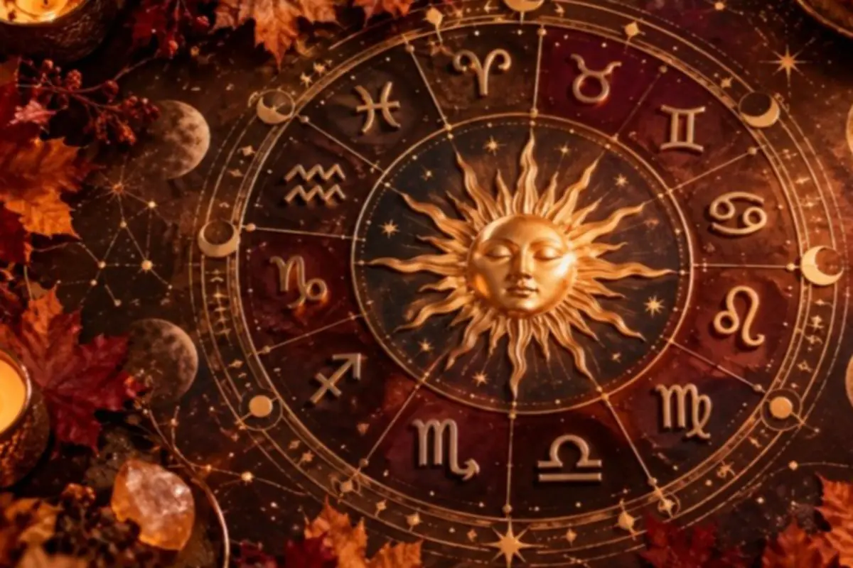 Mystical illustration of a golden zodiac circle with the sun at the center, surrounded by symbols of the twelve signs among autumn leaves and lit candles