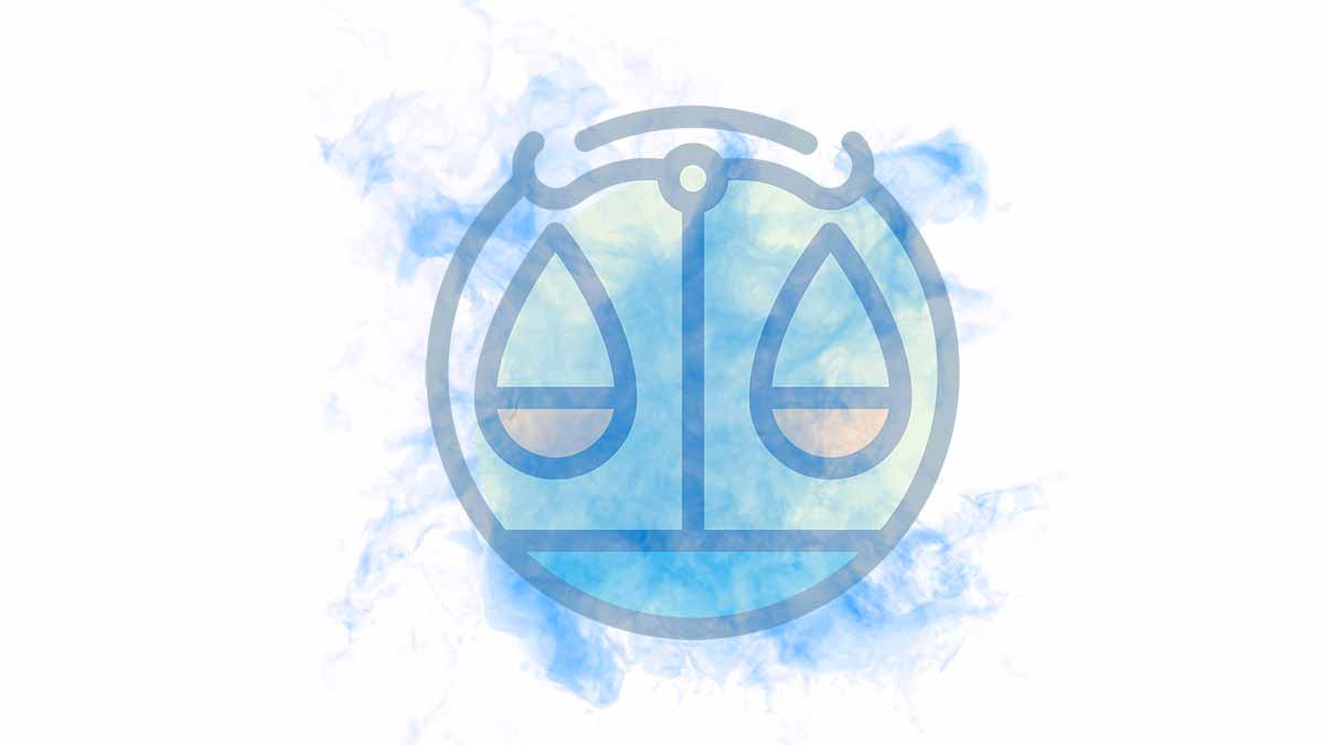 The Libra sign on a blue smoky blackground